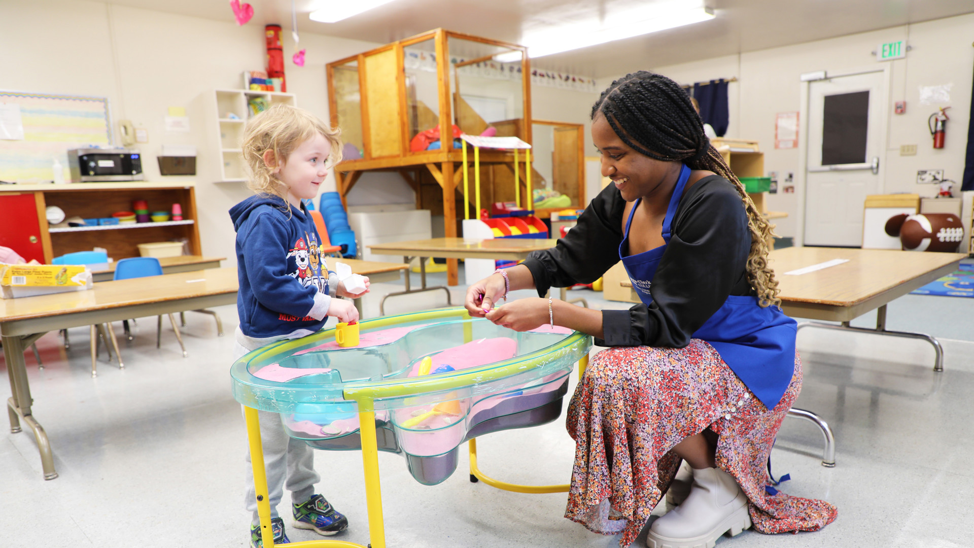 Early Childhood Development student with child